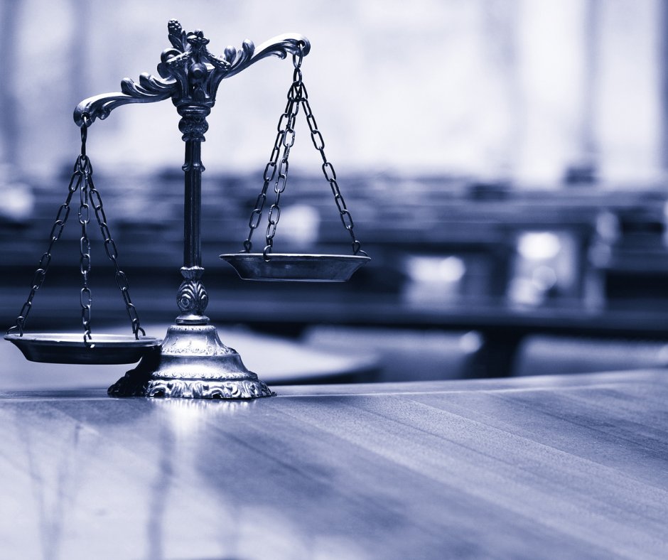 scales of justice in a courtroom