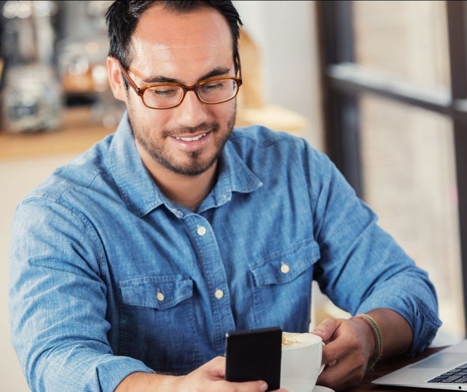 man using apps on his smart phone