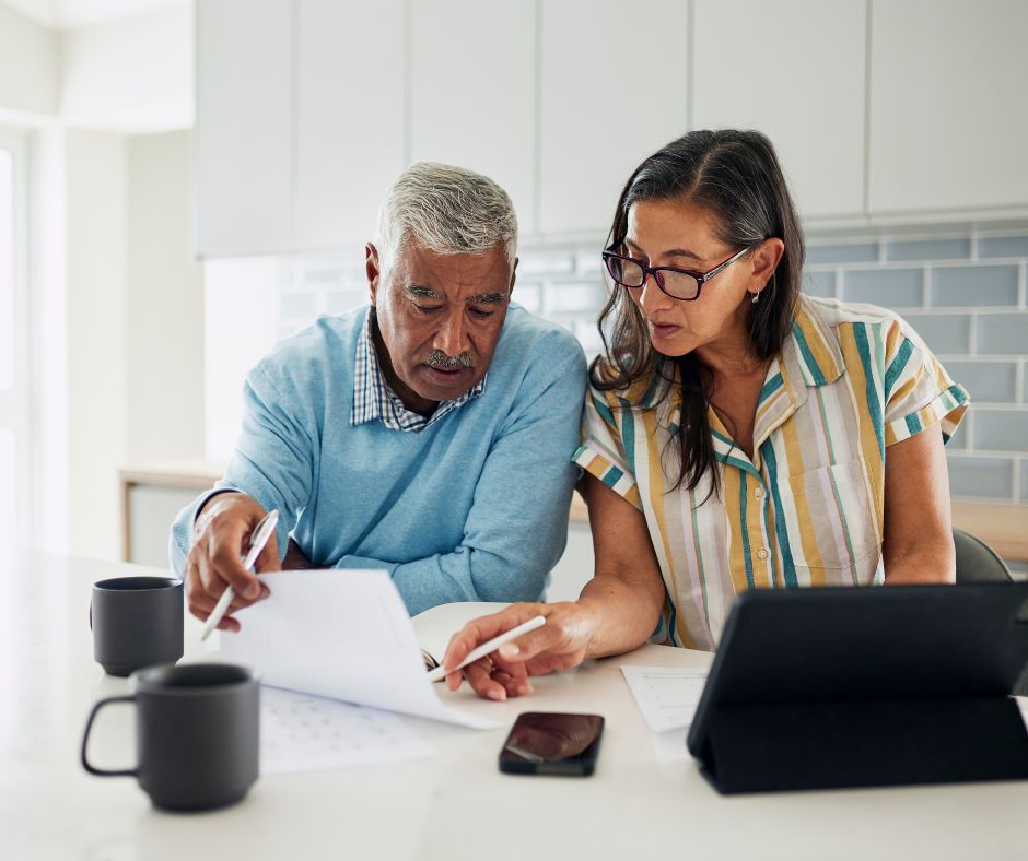 couple reviewing documents at home
